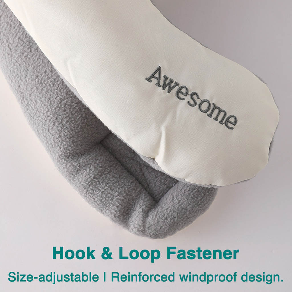 Close-up of a gray and white fabric item with "Awesome" embroidered on it, showing a hook and loop fastener. Text below describes it as size-adjustable and windproof.