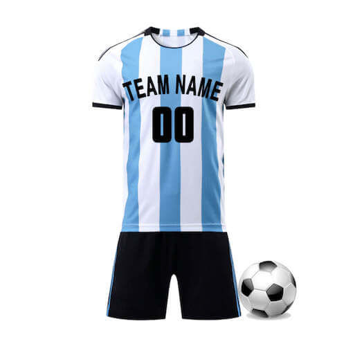 A soccer jersey with white and blue stripes along with black shorts placed next to a football